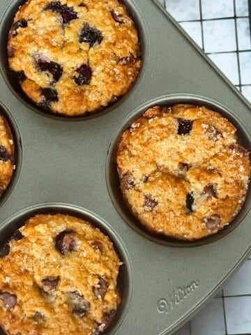 blueberry chocolate chip muffins in a baking pan